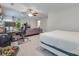 Bonus room featuring bed, sofa, desk, ceiling fan, and large area rug at 268 Hillsborough Ln, Rock Hill, SC 29732