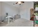 Bright home office featuring modern white desk, ceiling fan and neutral decor at 268 Hillsborough Ln, Rock Hill, SC 29732