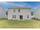 Back exterior with a sliding glass door leading to a backyard, and white siding and window trim at 2859 Sherrills Stream Dr, Sherrills Ford, NC 28673