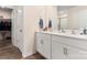 Bathroom featuring double sinks, white cabinets, and ample counter space at 2859 Sherrills Stream Dr, Sherrills Ford, NC 28673
