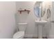 Cozy half-bathroom featuring a pedestal sink and modern fixtures at 2859 Sherrills Stream Dr, Sherrills Ford, NC 28673