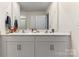 Bright bathroom with double vanity, white countertops, and modern fixtures at 2859 Sherrills Stream Dr, Sherrills Ford, NC 28673