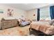 Cozy bedroom features a comfortable bed, wooden dresser, and bright natural light at 2859 Sherrills Stream Dr, Sherrills Ford, NC 28673
