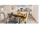 Open-concept dining area adjacent to a modern kitchen, creating a seamless flow at 2859 Sherrills Stream Dr, Sherrills Ford, NC 28673