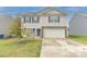 Charming two-story home with vinyl siding, stone accents, and a two-car garage at 2859 Sherrills Stream Dr, Sherrills Ford, NC 28673