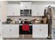 Bright kitchen with white cabinets, stainless steel microwave, and granite countertops at 2859 Sherrills Stream Dr, Sherrills Ford, NC 28673