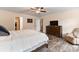 Large primary bedroom with wood-look floors, a ceiling fan, and a sitting area at 2859 Sherrills Stream Dr, Sherrills Ford, NC 28673