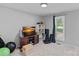 Bright bedroom features neutral walls, window with blinds, media center, and open closet space at 2934 Drakes Crossing Dr, Charlotte, NC 28262