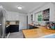 The functional kitchen features butcher block countertops, white subway tile, and black cabinets at 2934 Drakes Crossing Dr, Charlotte, NC 28262