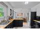 The well-designed kitchen opens to the dining area, featuring a large stainless refrigerator at 2934 Drakes Crossing Dr, Charlotte, NC 28262
