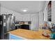 Efficient kitchen features stainless steel appliances, butcher block countertops, and ample storage at 2934 Drakes Crossing Dr, Charlotte, NC 28262