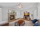 Inviting living room features a stone fireplace and TV and a comfortable sofa set at 2934 Drakes Crossing Dr, Charlotte, NC 28262