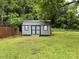 Backyard showing shed with small deck and fenced in yard at 303 Southern Ave, East Spencer, NC 28039