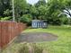 Backyard showing shed with small deck and fenced in yard at 303 Southern Ave, East Spencer, NC 28039