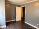 Bedroom featuring hardwood floors and neutral paint, offering a serene, ready-to-personalize space at 303 Southern Ave, East Spencer, NC 28039