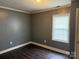 Bedroom featuring hardwood floors and a window with blinds, perfect for privacy and comfort at 303 Southern Ave, East Spencer, NC 28039
