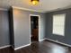 Bedroom with a window offering natural light, complemented by hardwood floors for a modern touch at 303 Southern Ave, East Spencer, NC 28039