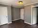 Spacious bedroom with hardwood floors and multiple entryways, creating a versatile living space at 303 Southern Ave, East Spencer, NC 28039