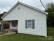 Charming single-story home with white siding and gray shutters and a wooden front porch at 303 Southern Ave, East Spencer, NC 28039