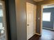 Hallway with painted grey walls and wood flooring at 303 Southern Ave, East Spencer, NC 28039