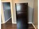 Kitchen with black refrigerator against the wall in this neutral home at 303 Southern Ave, East Spencer, NC 28039