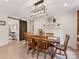 This dining room includes a dining table and updated lighting at 3042 Cresthill Dr, Charlotte, NC 28212