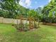 Wooden garden structure for growing vegetables in the backyard at 3042 Cresthill Dr, Charlotte, NC 28212