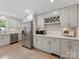 Updated kitchen featuring stainless steel appliances, white countertops, and shaker style cabinets at 3042 Cresthill Dr, Charlotte, NC 28212