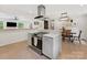 Contemporary kitchen with an island, stainless steel oven, and seamless flow to the dining area at 3042 Cresthill Dr, Charlotte, NC 28212