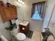 Bathroom with wood-look flooring, a wood vanity, and neutral decor and lighting at 311 Tiffany Nw St, Concord, NC 28027
