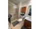 Bright bathroom with a shower and storage cabinet at 311 Tiffany Nw St, Concord, NC 28027