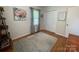 Bedroom with wood floors, an area rug, and natural light from one window at 311 Tiffany Nw St, Concord, NC 28027