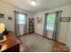 Bedroom with light gray walls, wood floors, and two windows for natural light at 311 Tiffany Nw St, Concord, NC 28027
