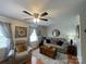 Inviting living room featuring hardwood floors, neutral-toned furniture, and ample natural light at 311 Tiffany Nw St, Concord, NC 28027