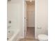 Well-lit bathroom with a shower-tub combo, toilet, and walk-in closet access at 3349 Ellingford Rd, Charlotte, NC 28214