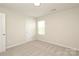 Bright bedroom features neutral carpet and natural light from the window at 3349 Ellingford Rd, Charlotte, NC 28214