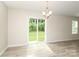 Bright dining area featuring sliding doors to outdoor space and natural light at 3349 Ellingford Rd, Charlotte, NC 28214