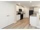 Bright kitchen features white cabinets, modern appliances, and sleek countertops at 3349 Ellingford Rd, Charlotte, NC 28214