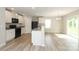 Well-lit kitchen boasts granite counters, black appliances, and an open layout at 3349 Ellingford Rd, Charlotte, NC 28214
