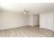 Open living space with light-colored walls, modern flooring, a ceiling fan, and ample closet space at 3349 Ellingford Rd, Charlotte, NC 28214