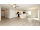 Bright, open living area with modern flooring, neutral walls, and an adjacent kitchen area at 3349 Ellingford Rd, Charlotte, NC 28214
