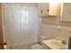 Bathroom with patterned shower curtain, white tile and sink with a white cabinet at 3505 Valley Dr, Chester, SC 29706
