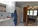 Bathroom with a white vanity, shower curtain, grab bar, and a doorway leading to the bedroom at 3505 Valley Dr, Chester, SC 29706