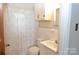 Bathroom with patterned shower curtain, white tile and sink with a white cabinet at 3505 Valley Dr, Chester, SC 29706