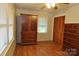 Bedroom with hardwood floors featuring a large wardrobe and dresser at 3505 Valley Dr, Chester, SC 29706