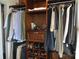 Organized closet with shelving, drawers, rods, shoes and folded shirts and hung pants, shirts and jackets at 3505 Valley Dr, Chester, SC 29706