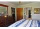 Bedroom featuring a wooden dresser and doorways that lead to a laundry room and a bathroom at 3505 Valley Dr, Chester, SC 29706