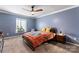 Comfortable bedroom featuring a full-sized bed, carpet, and great natural lighting at 3520 Colony Rd # D, Charlotte, NC 28211