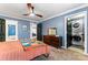 Well-lit bedroom with ensuite bathroom, laundry area, and stylish wooden dresser for modern living at 3520 Colony Rd # D, Charlotte, NC 28211