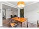 Comfortable dining room with wood table, modern lighting, and a view of the sitting room at 3520 Colony Rd # D, Charlotte, NC 28211